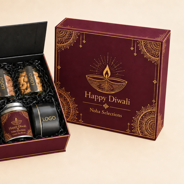 An open dark red and black gift box containing three small jars and a tin, displayed beside the matching closed box on a warm beige background. The closed box has gold decorative patterns and reads 'Happy Diwali Nisha Selections'.